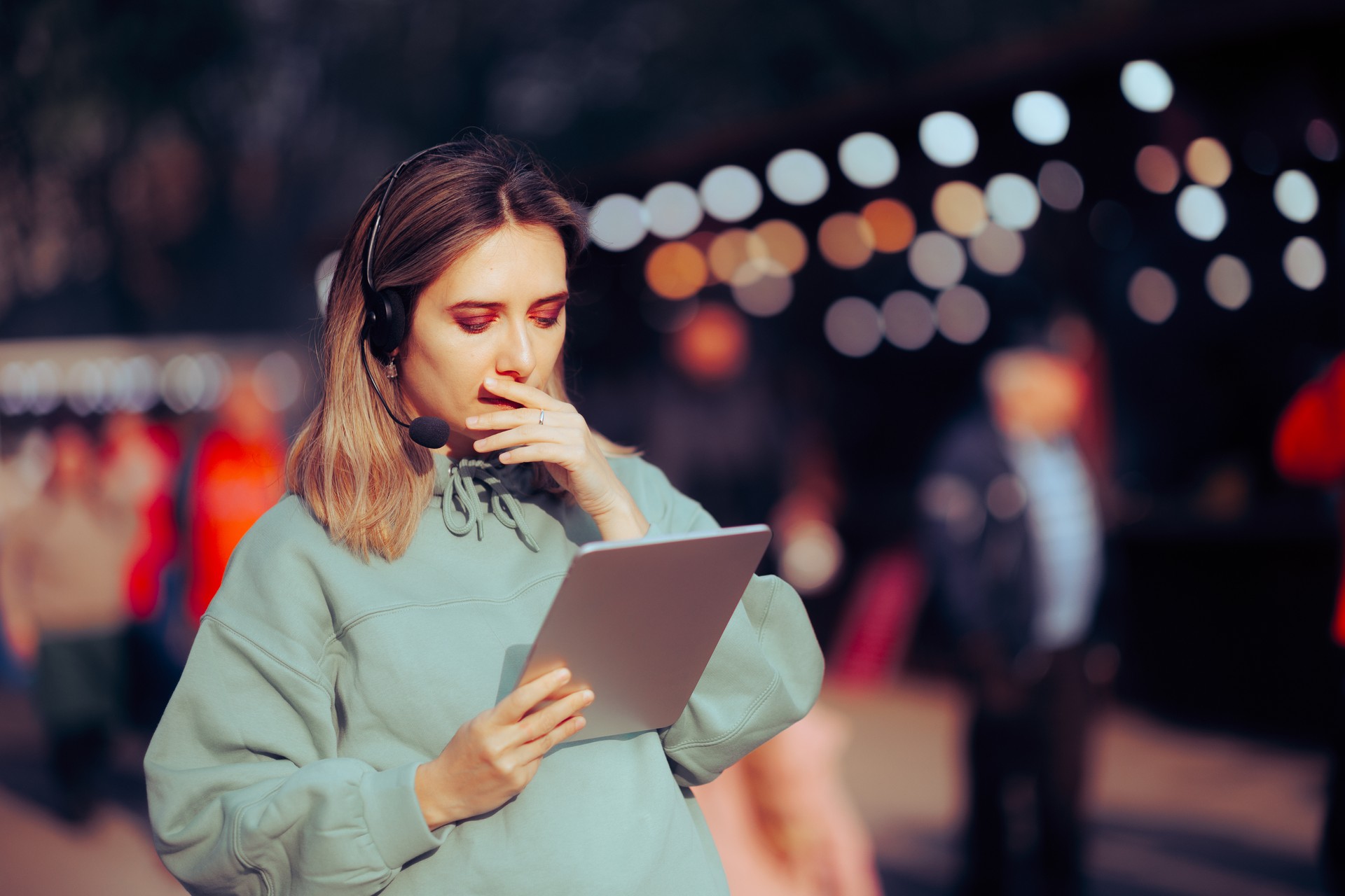 Worried Event Manager Using Pc Tablet Checking Schedule